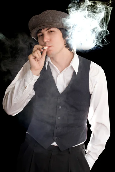 Young Man Puffing Out Isolated Black — Stock Photo, Image