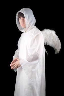 Young man wearing angel suit. Isolated on black clipart