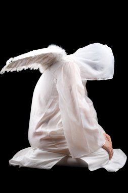 Sitting man dressed in angel suit. Isolated on black clipart