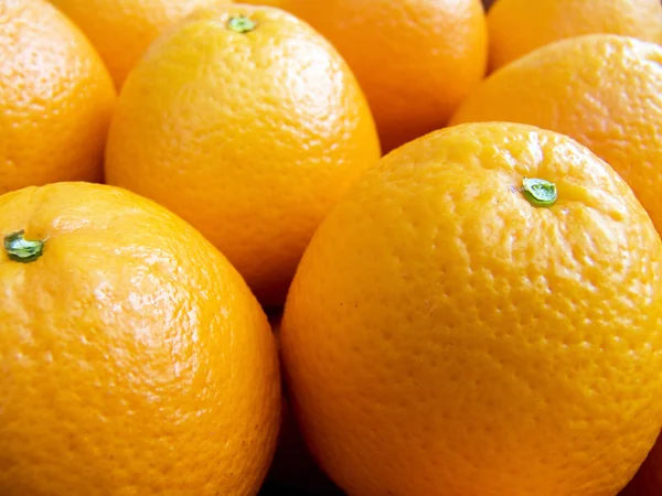 Sinaasappelen op een teller macro — Stockfoto