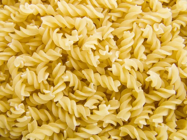 Spiral pasta background — Stock Photo, Image