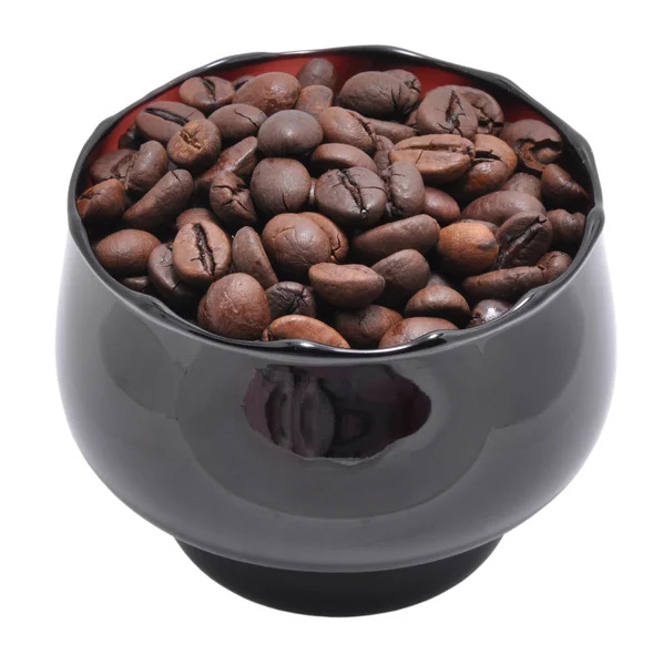 Grãos de café estão em uma xícara — Fotografia de Stock