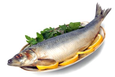 Herring on plate with gerbs and lemon clipart