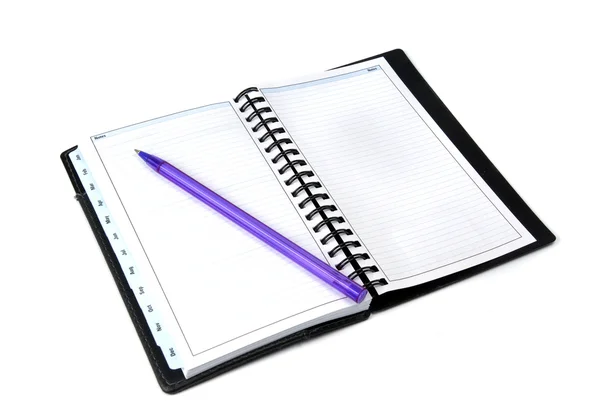 在白色背景上的笔记本和蓝色铅笔 — 图库照片