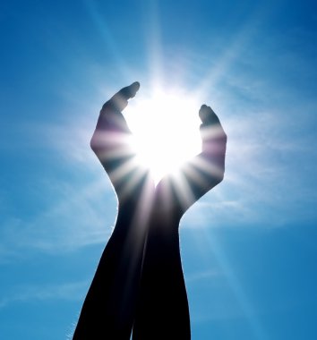 Sun in hands. clipart