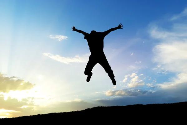 Muž skok na obloze — Stock fotografie