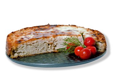 Meat pie on a tray with small red tomatoes isolated on white background. clipart