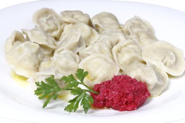 Boiled dumplings on a plate clipart