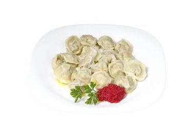 Boiled dumplings on a plate clipart