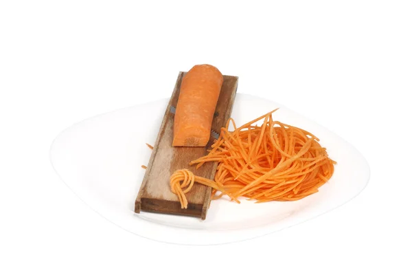 Сырая морковь, разрезанная на палочки, и плавающая — стоковое фото
