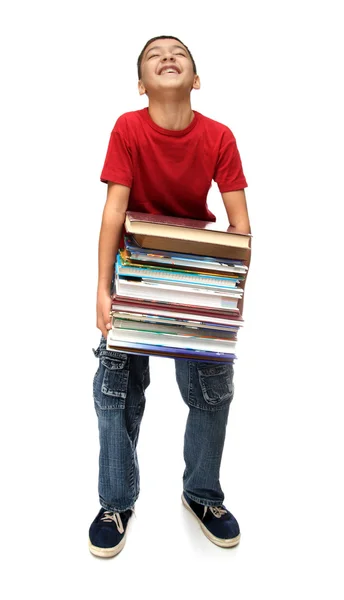 Asyalı çocuk kitap yığını ile — Stok fotoğraf