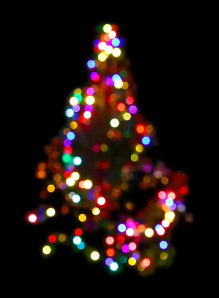 Abeto de Natal com iluminações desfocadas — Fotografia de Stock