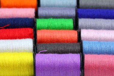 Lot of colored thread spools clipart