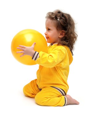 Cute little girl playing with ball clipart