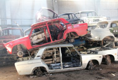 Cars is returned for recycling as scrap metal clipart