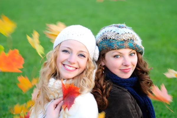 Two girl under the maple tree — Stock Photo, Image