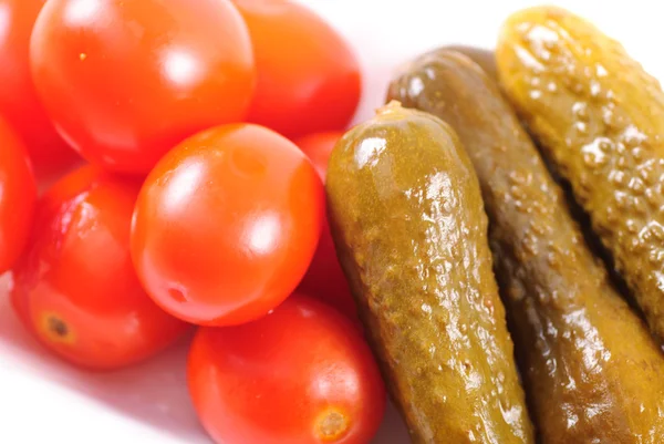 Pickled tomatoes and cucumbers — Stock Photo, Image