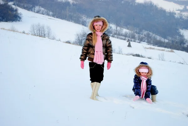 Two Little Sisters Playing Snow Outdoors — Stock Photo, Image