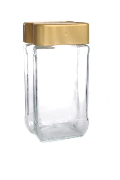Glasgefäß mit goldenem Deckel — Stockfoto