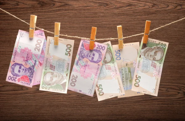 stock image Ukrainian grivna notes Hanging on Rope with Clothespins