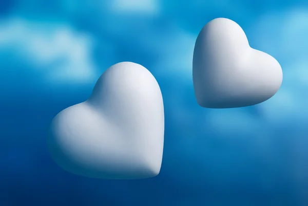 Two Hearts Out Focus Blue Sky Background — Stock Photo, Image