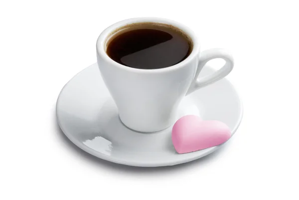 Tasse Kaffee mit rosa herzförmigem Keks — Stockfoto