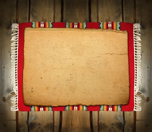 De textiel traditioneel mat op hout achtergrond — Stockfoto