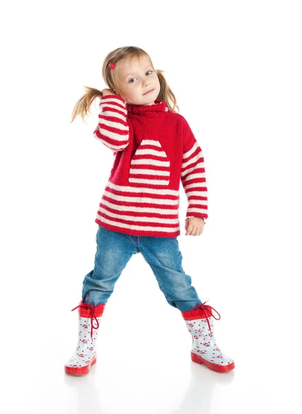 스웨터와 장화를 착용 하는 어린 소녀 — Stock Fotó