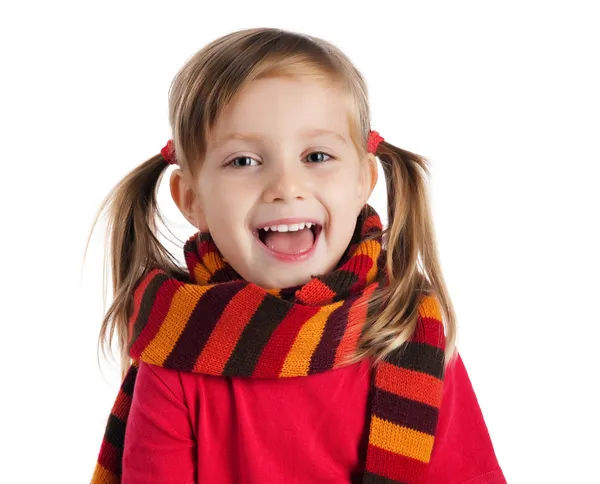 Cute little girl in a striped scarf — Stock Photo, Image