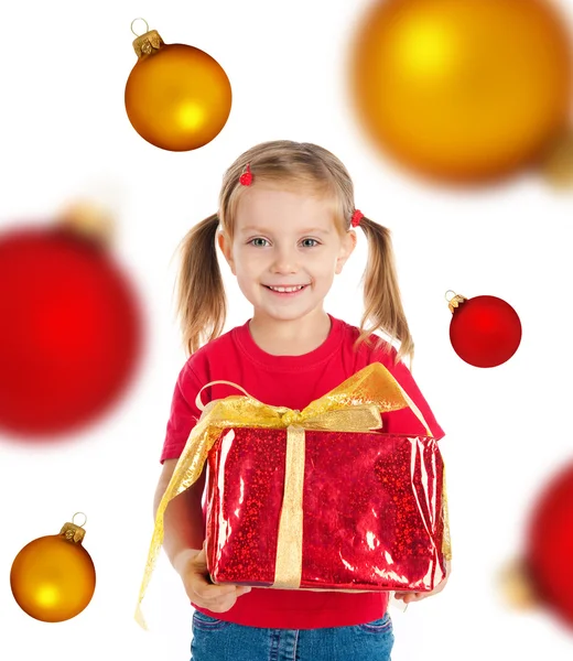 Roztomilá dívka s vánočními dárky a koule — Stock fotografie