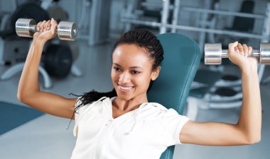 Young women at the fitness club clipart