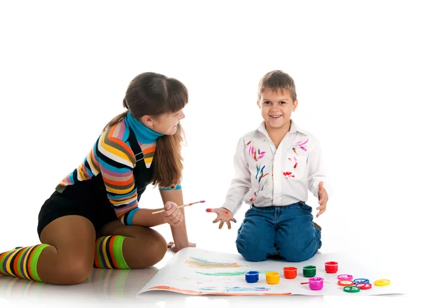Boy and his mom covered in bright paint — Stock Photo, Image