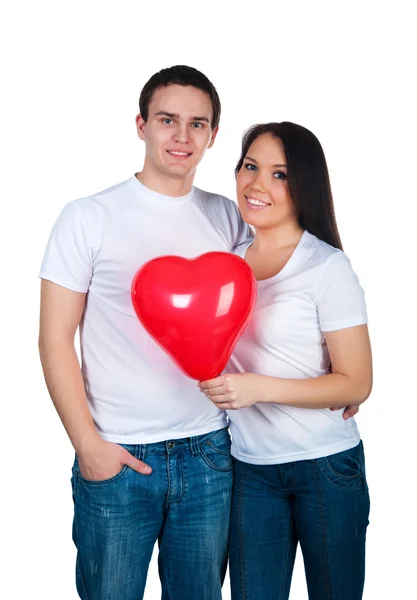 Jeune couple avec un coeur — Photo