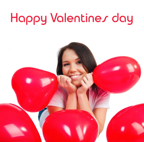 Cute young girl with a red hearts — Stock Photo, Image