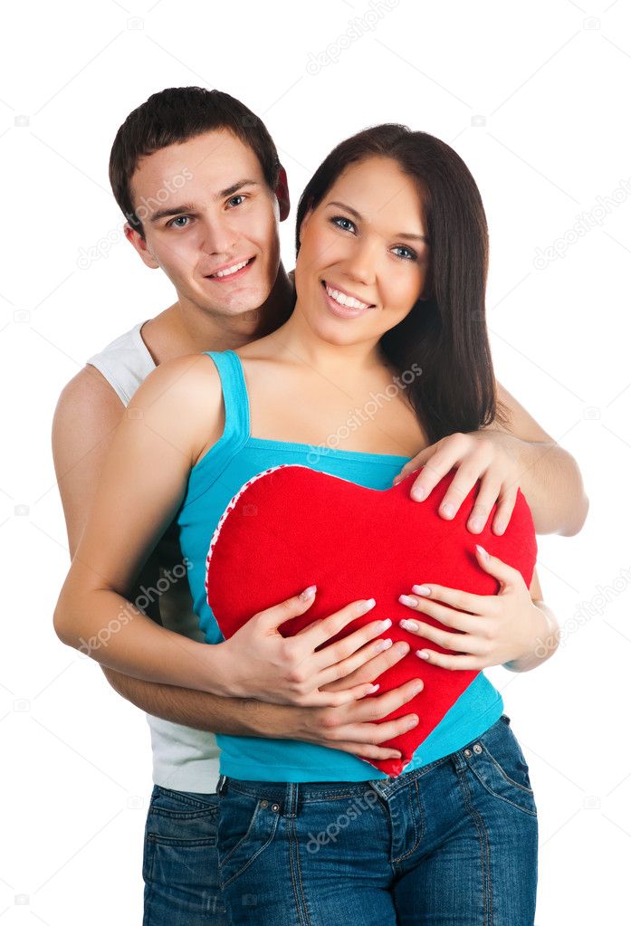 Young couple with a heart over white background