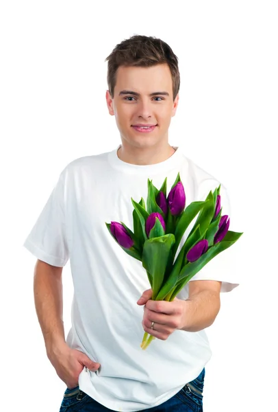 Bonitos jovens dão as flores — Fotografia de Stock