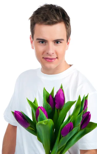 Lindos hombres jóvenes dan las flores — Foto de Stock