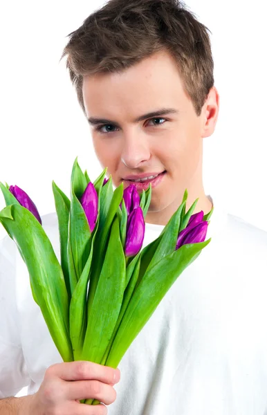 Lindos hombres jóvenes dan las flores —  Fotos de Stock