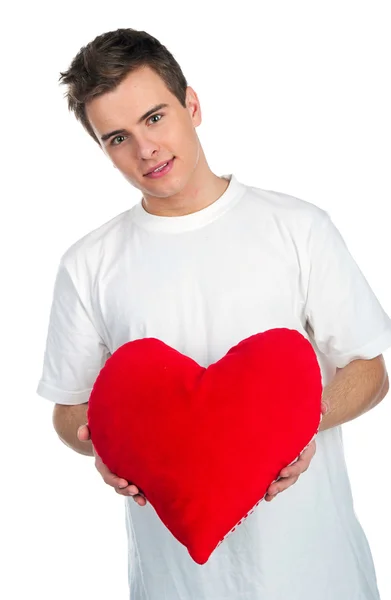 Bonito jovem menl com um coração vermelho — Fotografia de Stock