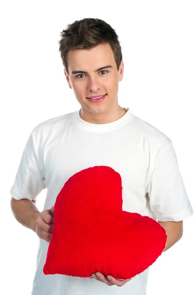 Милый молодой мужчина с красным сердцем — стоковое фото