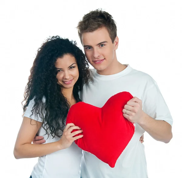 Jeune couple avec un coeur — Photo