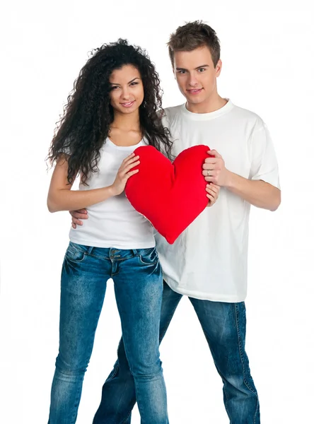 Young couple with a heart Royalty Free Stock Photos