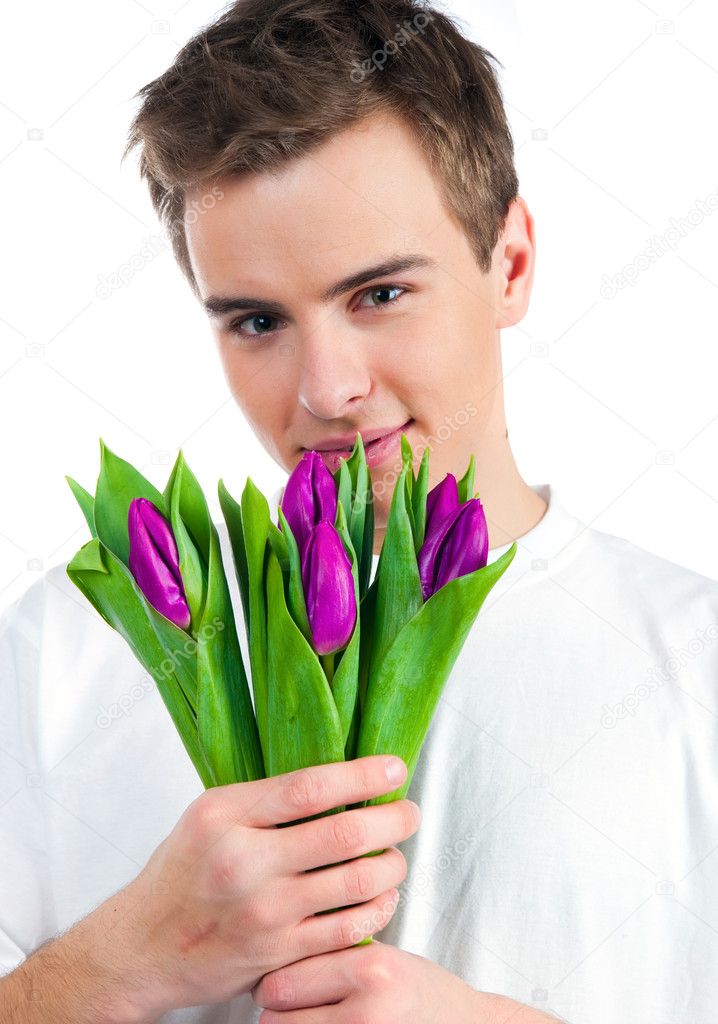 Cute young men give the flowers over white backgroung