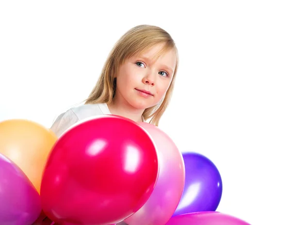Söt liten flicka med ballonger — Stockfoto