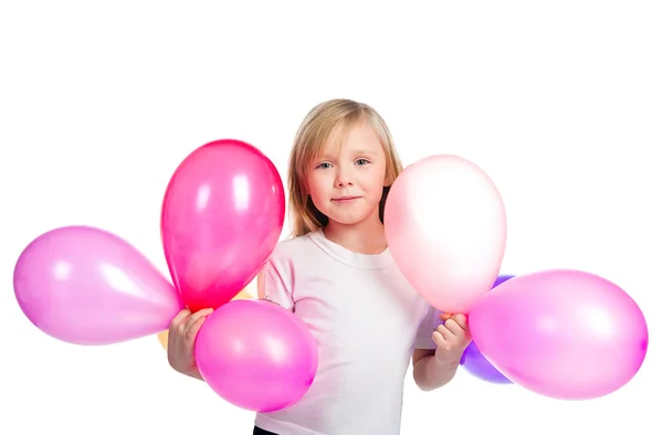 Söt liten flicka med ballonger — Stockfoto