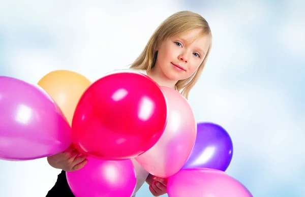 Niña bonita con globos — Foto de Stock