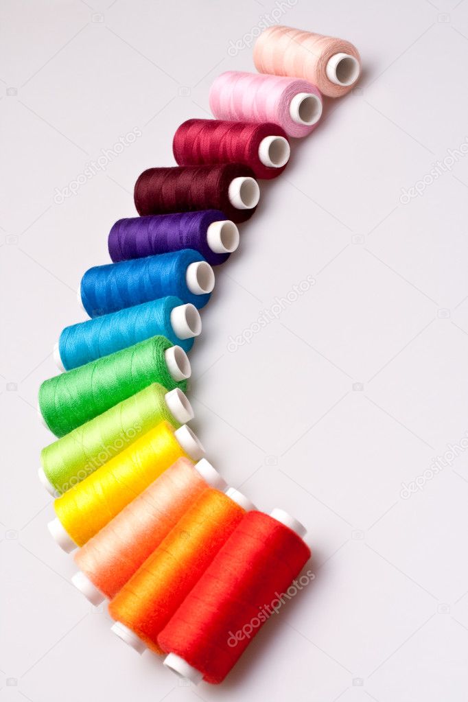 multi-colored rainbow threads for sewing, Stock image