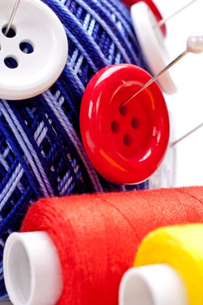 Pins in wool ball with buttons — Stock Photo, Image