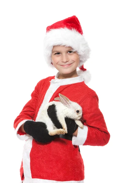 男孩抱着一只圣诞兔子 — 图库照片