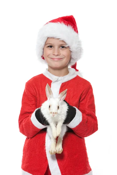 Niño sosteniendo un conejo de Navidad — Foto de Stock